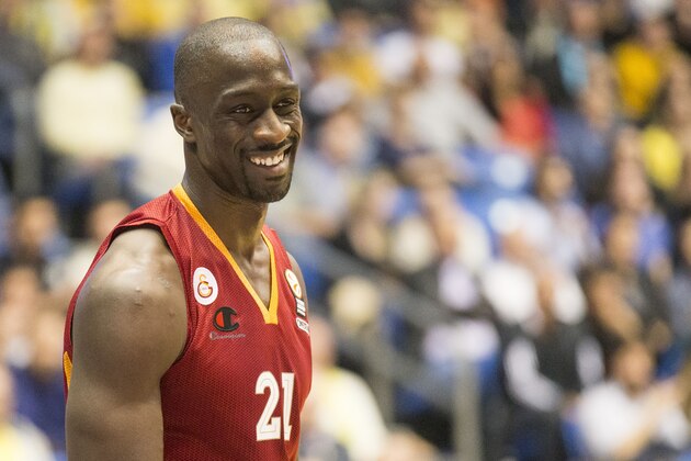 Galatasaray' forward Pops Mensah-Bonsu smiles during the Euroleague Top 16, group F, round 8, basketball match between Turkish Galatasaray Liv Hospital Istanbul and Israeli Maccabi Electra Tel Aviv on February 27, 2014, at the Nokia stadium in the Mediterranean coastal city of Tel Aviv, Israel. AFP PHOTO / JACK GUEZ        (Photo credit should read JACK GUEZ/AFP/Getty Images)
