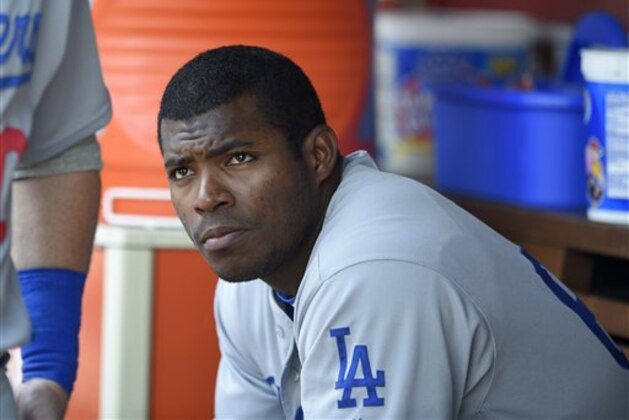 Los Angeles Dodgers' Yasiel Puig looks on from the dugout during a baseball game against the Washington Nationals, Thursday, July 21, 2016, in Washington. (AP Photo/Nick Wass)