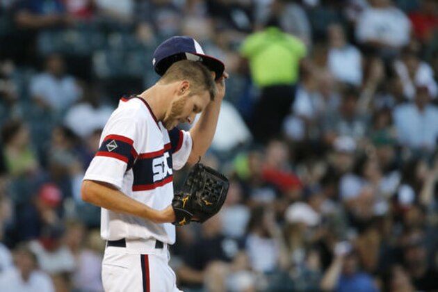 Chicago White Sox starting pitcher Chris Sale returns to the mound during the third inning of a baseball game against the Detroit Tigers Wednesday, June 15, 2016, in Chicago. (AP Photo/Charles Rex Arbogast)