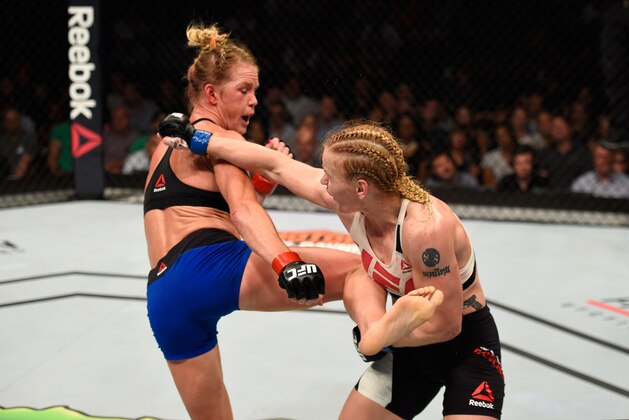 CHICAGO, IL - JULY 23:  (L-R) Holly Holm kicks Valentina Shevchenko of Kyrgyzstan in their women's bantamweight bout during the UFC Fight Night event at the United Center on July 23, 2016 in Chicago, Illinois. (Photo by Josh Hedges/Zuffa LLC/Zuffa LLC via Getty Images)