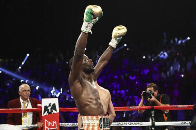 Terence Crawford celebrates after defeating Viktor Postol by unanimous decision in their WBC-WBO junior welterweight title unification bout in Las Vegas on Saturday, July 23, 2016. (AP Photo/Chase Stevens)