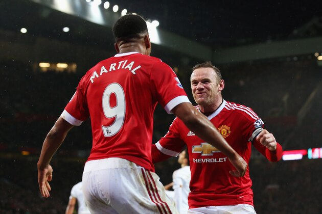 MANCHESTER, ENGLAND - JANUARY 02:  Wayne Rooney (R) of Manchester United celebrates scoring his team's second goal with his team mate Anthony Martial (L) during the Barclays Premier League match between Manchester United and Swansea City at Old Trafford on January 2, 2016 in Manchester, England.  (Photo by Alex Livesey/Getty Images)