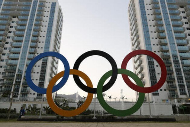 A representation of the Olympic rings are displayed  in the Olympic Village in Rio de Janeiro, Brazil, Saturday, July 23, 2016. The brand new complex of residential towers are where nearly 11,000 athletes and some 6,000 coaches and other handlers will sleep, eat and train during the upcoming games, that will kickoff on Aug. 5(AP Photo/Leo Correa)