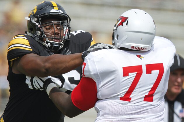 IOWA CITY, IA - SEPTEMBER 5:  Defensive lineman Faith Ekakitie #56 of the Iowa Hawkeyes faces off in the fourth quarter against offensive lineman Kyle Avaloy #77 of the Illinois State Redbirds on September 5, 2015 at Kinnick Stadium, in Iowa City, Iowa.  (Photo by Matthew Holst/Getty Images)