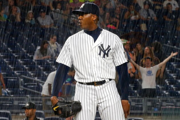 NEW YORK, NY - JUNE 27:  Aroldis Chapman #54 of the New York Yankees looks on before a rain delay against the Texas Rangers at Yankee Stadium on June 27, 2016 in the Bronx borough of New York City. The Rangers defeated the Yankees 9-6.  (Photo by Jim McIsaac/Getty Images)
