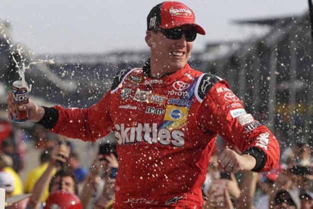 Kyle Busch celebrates after winning the Brickyard 400 NASCAR auto race at Indianapolis Motor Speedway in Indianapolis, Sunday, July 24, 2016. (AP Photo/Michael Conroy)