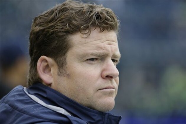 Seattle Seahawks general manager John Schneider watches warmups before an NFL football game against the Carolina Panthers, Sunday, Oct. 18, 2015, in Seattle. (AP Photo/Elaine Thompson)