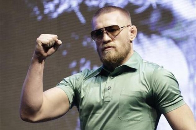 Conor McGregor arrives at a UFC 202 mixed martial arts news conference, Thursday, July 7, 2016, in Las Vegas. McGregor is scheduled to fight Nate Diaz at UFC 202 in Las Vegas. (AP Photo/John Locher)