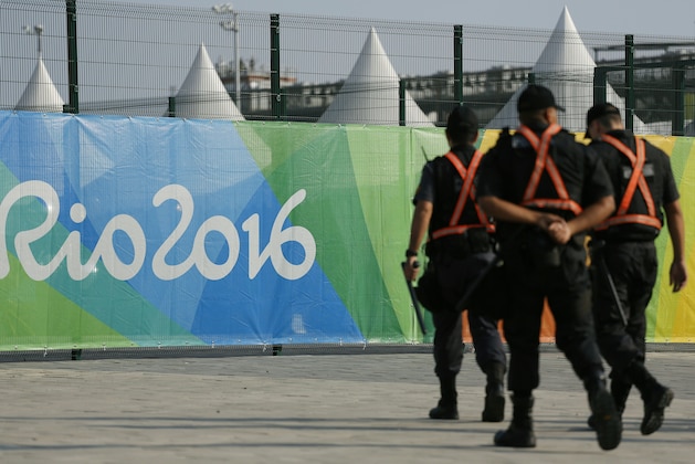 Members of the security forces patrol outside the venues for the upcoming 2016 Rio Olympic Games on July 23, 2016 in Rio de Janeiro, Brazil.   / AFP / DAVID GANNON        (Photo credit should read DAVID GANNON/AFP/Getty Images)