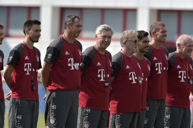 Bayern Munich's new Italian head coach Carlo Ancelotti (C) and assistant coach Paul Clement (3rdL) pose with other staff members ahead of the first training of the German first division Bundesliga football club FC Bayern Munich, in Munich, southern Germany on July 11, 2016. / AFP / GUENTER SCHIFFMANN        (Photo credit should read GUENTER SCHIFFMANN/AFP/Getty Images)