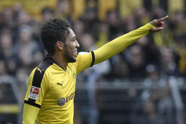 Dortmund's Pierre-Emerick Aubameyang celebrates after scoring his second goal during the German Bundesliga soccer match between Borussia Dortmund and VfL Wolfsburg in Dortmund, Germany, Saturday, April 30, 2016. (AP Photo/Martin Meissner)