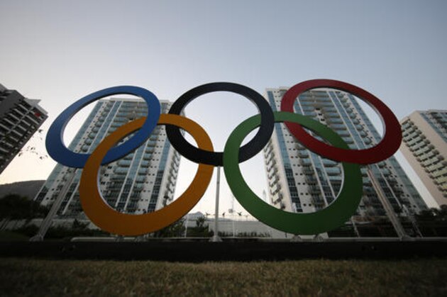 A representation of the Olympic rings are displayed in the Olympic Village in Rio de Janeiro, Brazil, Saturday, July 23, 2016. The brand new complex of residential towers are where nearly 11,000 athletes and some 6,000 coaches and other handlers will sleep, eat and train during the upcoming games, that will kickoff on Aug. 5. (AP Photo/Leo Correa)