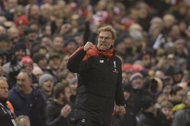 Liverpool's German manager Jurgen Klopp celebrates their late equalising goal to level the score at 2-2 the English Premier League football match between Liverpool and West Bromwich Albion at Anfield in Liverpool, northwest England, on December 13, 2015.  AFP PHOTO / OLI SCARFF

RESTRICTED TO EDITORIAL USE. No use with unauthorized audio, video, data, fixture lists, club/league logos or 'live' services. Online in-match use limited to 75 images, no video emulation. No use in betting, games or single club/league/player publications. / AFP / OLI SCARFF        (Photo credit should read OLI SCARFF/AFP/Getty Images)