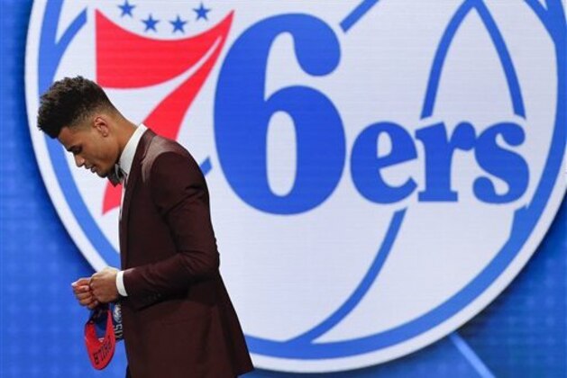 Timothe Luwawu-Cabarrot walks off stage after being selected 24th overall by the Philadelphia 76ers during the NBA basketball draft, Thursday, June 23, 2016, in New York. (AP Photo/Frank Franklin II)