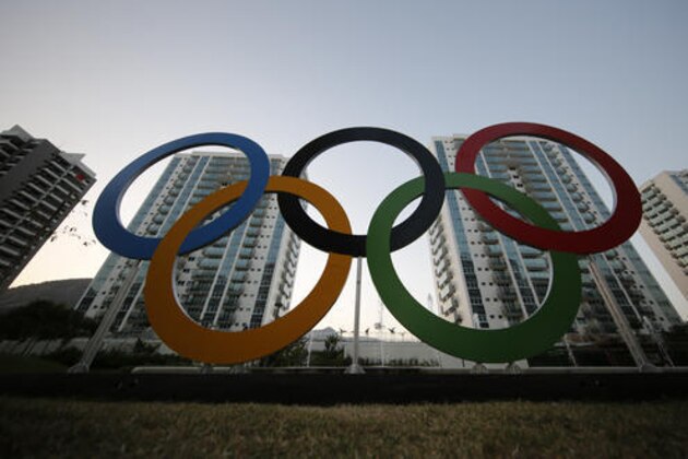 A representation of the Olympic rings are displayed in the Olympic Village in Rio de Janeiro, Brazil, Saturday, July 23, 2016. The brand new complex of residential towers are where nearly 11,000 athletes and some 6,000 coaches and other handlers will sleep, eat and train during the upcoming games, that will kickoff on Aug. 5. (AP Photo/Leo Correa)