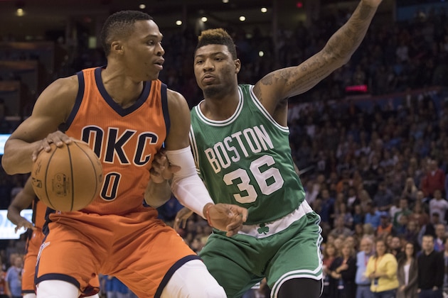 OKLAHOMA CITY, OK - NOVEMBER 15: Marcus Smart #36 of the Boston Celtics tries to block Russell Westbrook #0 of the Oklahoma City Thunder during the first quarter of a NBA game at the Chesapeake Energy Arena on November 15, 2015 in Oklahoma City, Oklahoma. NOTE TO USER: User expressly acknowledges and agrees that, by downloading and or using this photograph, User is consenting to the terms and conditions of the Getty Images License Agreement. (Photo by J Pat Carter/Getty Images)