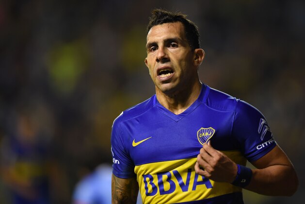 Argentinas Boca Juniors Carlos Tevez celebrates after scoring against Bolivia's Bolivar during their Copa Libertadores group 3 football match at the 'Bombonera' stadium in Buenos Aires, Argentina, on April 7, 2016. / AFP / EITAN ABRAMOVICH        (Photo credit should read EITAN ABRAMOVICH/AFP/Getty Images)
