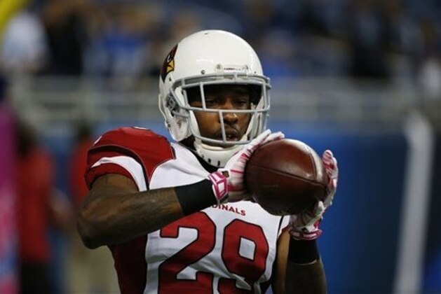 Arizona Cardinals defensive back Chris Clemons (29) catches a ball during pre-game warmups of an NFL football game against the Detroit Lions, Sunday, Oct. 11, 2015, in Detroit. (AP Photo/Paul Sancya)