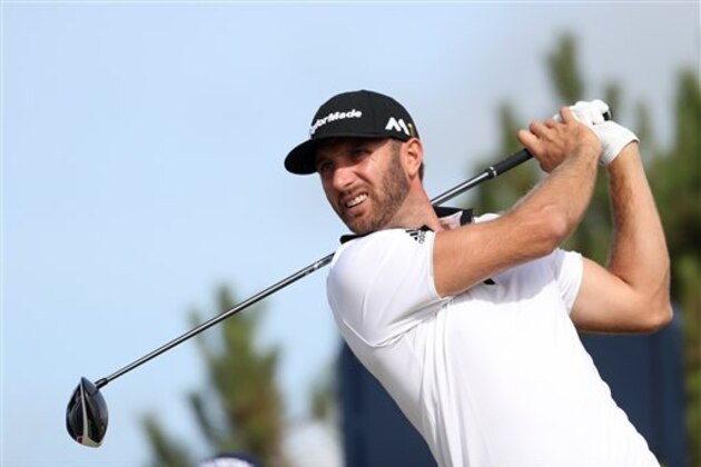 Dustin Johnson of the United States tees off from the 13th during the first round of the British Open Golf Championship at the Royal Troon Golf Club in Troon, Scotland, Thursday, July 14, 2016. (AP Photo/Peter Morrison)
