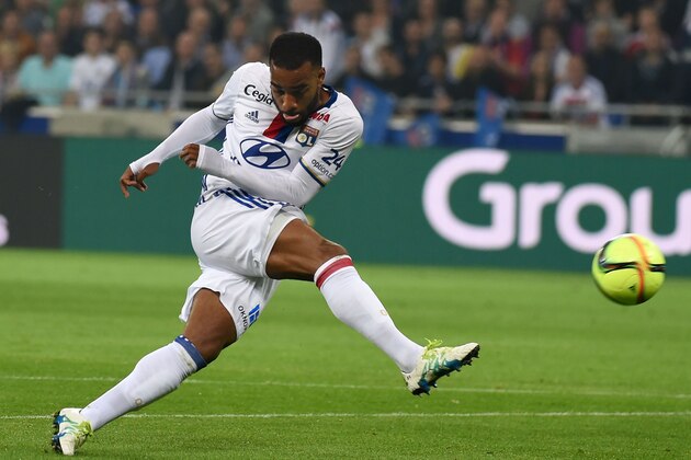 Lyon's French forward Alexandre Lacazette shoots the ball during the French L1 football match Olympique Lyonnais and AS Monaco on May 7, 2016, at the New Stadium in Decines-Charpieu near Lyon, southeastern France.      AFP PHOTO/PHILIPPE DESMAZES / AFP / PHILIPPE DESMAZES        (Photo credit should read PHILIPPE DESMAZES/AFP/Getty Images)