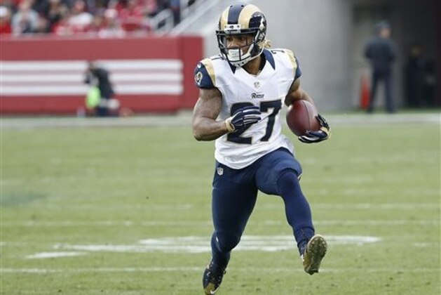 In this Sunday, Jan. 3, 2016 photo, St. Louis Rams running back Tre Mason (27) runs against the San Francisco 49ers during the second half of an NFL football game in Santa Clara, Calif. Mason refused to cooperate with officers who were arresting him in South Florida for reckless driving and marijuana possession, police in Hollywood, Florida, said Sunday, March 6. (AP Photo/Tony Avelar)