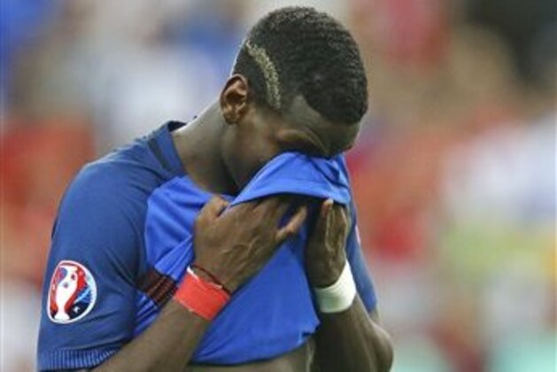 France's Paul Pogba reacts at the end of the Euro 2016 final soccer match between Portugal and France at the Stade de France in Saint-Denis, north of Paris, Sunday, July 10, 2016. Portugal won the match 1-0. (AP Photo/Michael Probst)