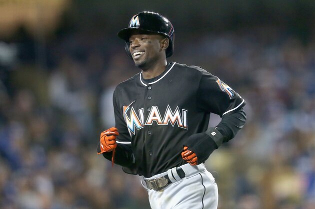 LOS ANGELES, CALIFORNIA - APRIL 28:  Dee Gordon #9 of the Miami Marlins laughs as he returns to the dugout after scoring a run on a balk in the seventh inning against the Los Angeles Dodgers at Dodger Stadium on April 28, 2016 in Los Angeles, California.  (Photo by Stephen Dunn/Getty Images)