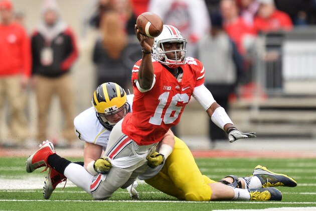 COLUMBUS, OH - NOVEMBER 29: Quarterback J.T. Barrett #16 of the Ohio State Buckeyes is sacked by Jake Ryan #47 of the Michigan Wolverines  in the first quarter at Ohio Stadium on November 29, 2014 in Columbus, Ohio.  (Photo by Jamie Sabau/Getty Images)