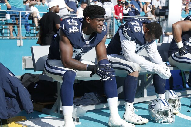 MIAMI GARDENS, FL - NOVEMBER 22: Randy Gregory #94 and Greg Hardy #76 of the Dallas Cowboys sit on the bench against the Miami Dolphins during the game at Sun Life Stadium on November 22, 2015 in Miami Gardens, Florida. Dallas defeated Miami 24-14. (Photo by Joe Robbins/Getty Images)