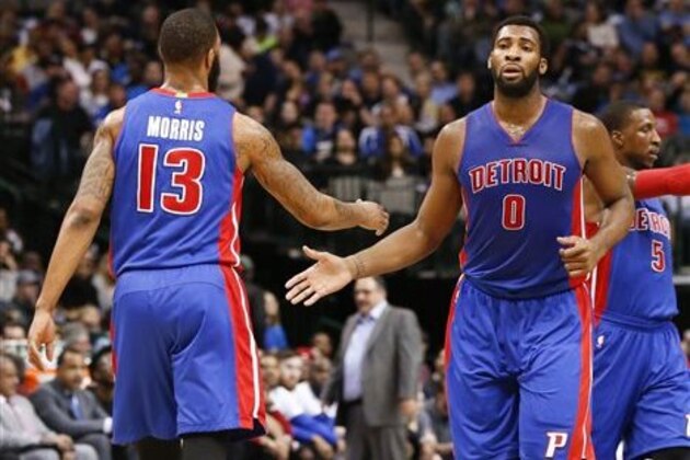 Detroit Pistons center Andre Drummond (0) celebrates his score with forward Marcus Morris (13) against the Dallas Mavericks during the first half of an NBA basketball game, Wednesday, March 9, 2016, in Dallas. (AP Photo/Jim Cowsert)
