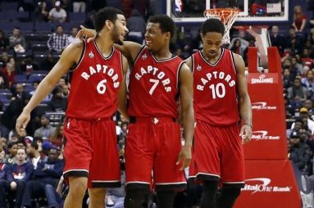 Toronto Raptors center Bismack Biyombo (8), from the Democratic Republic of the Congo, guard Cory Joseph (6), guard Kyle Lowry (7) and guard DeMar DeRozan (10) walk back to the bench for a timeout in the second half of an NBA basketball game against the Washington Wizards, Friday, Jan. 8, 2016, in Washington. The Raptors won 97-88. (AP Photo/Alex Brandon)
