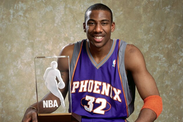 PHOENIX - APRIL 25:  Portrait of Amare Stoudemire #32 of the Phoenix Suns with the 2003 Got Milk? Rookie of the Year trophy on April 25, 2003 in Phoenix, Arizona.  NOTE TO USER: User expressly acknowledges and agrees that, by downloading and/or using this Photograph, User is consenting to the terms and conditions of the Getty Images License Agreement.  Mandatory Copyright Notice:  Copyright 2003 NBAE.  (Photo by Barry Gossage/NBAE via Getty Images)