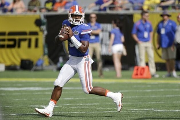 Florida quarterback Treon Harris (3) looks for a receiver against Michigan during the first half of the Citrus Bowl NCAA college football game, Friday, Jan. 1, 2016, in Orlando, Fla. (AP Photo/John Raoux)