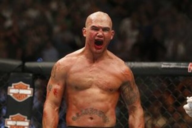 Robbie Lawler celebrates after defeating Rory MacDonald during their welterweight title fight mixed martial arts bout at UFC 189 Saturday, July 11, 2015, in Las Vegas. (AP Photo/John Locher)