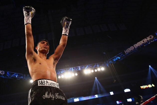 DALLAS, TX - JUNE 15:  Mikey Garcia celebrates after knocking out Juan Manuel Lopez in the fourth round during their Vacant WBO Featherweight Title bout at American Airlines Center on June 15, 2013 in Dallas, Texas.  (Photo by Tom Pennington/Getty Images)