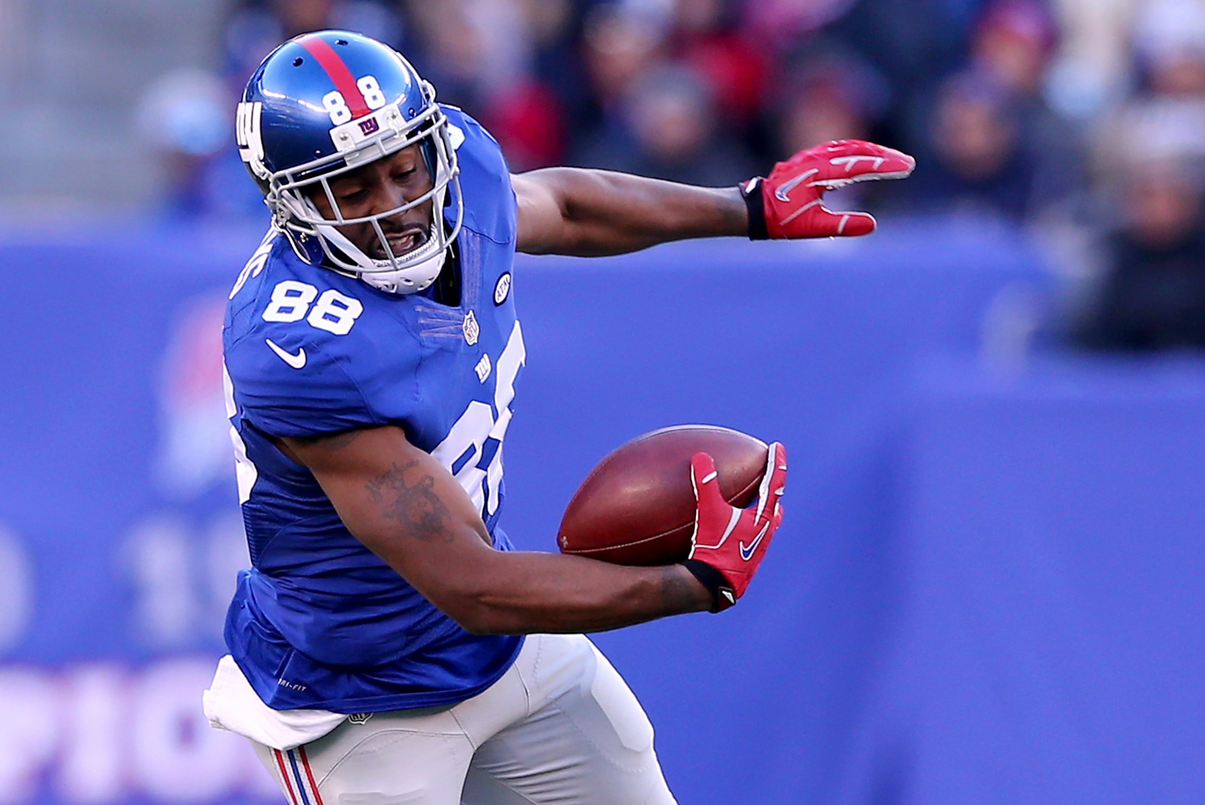 EAST RUTHERFORD, NJ - JANUARY 03:   Hakeem Nicks #88 of the New York Giants is tackled by  Chris Maragos #42 of the Philadelphia Eagles at MetLife Stadium on January 3, 2016 in East Rutherford, New Jersey.The Philadelphia Eagles defeated the New York Giants 35-30.  (Photo by Elsa/Getty Images)