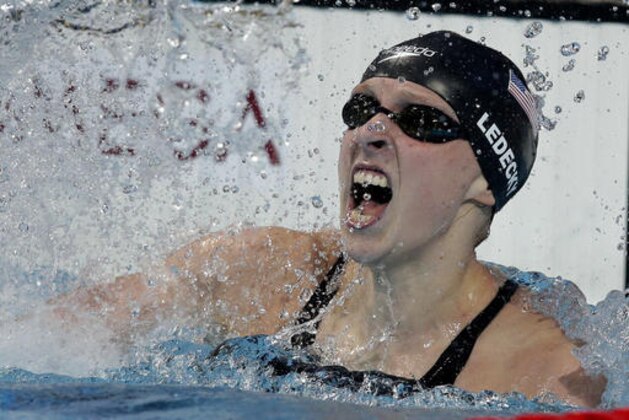FILE - In this Aug. 8, 2015, file photo, Katie Ledecky, of the United States, celebrates after winning the women's 800m freestyle final at the Swimming World Championships in Kazan, Russia. Ledecky has gone from a surprise gold medalist in London to one of the world’s most dominant swimmers at age 19. (AP Photo/Michael Sohn, File) FILE - In this Aug. 8, 2015, file photo, Katie Ledecky, of the United States, celebrates after winning the women's 800m freestyle final at the Swimming World Championships in Kazan, Russia. Ledecky has gone from a surprise gold medalist in London to one of the world’s most dominant swimmers at age 19. (AP Photo/Michael Sohn, File)