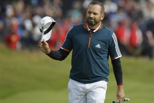 Sergio Garcia of Spain acknowledges the crowd as he walks onto the 18th green during the final round of the British Open Golf Championship at the Royal Troon Golf Club in Troon, Scotland, Sunday, July 17, 2016. (AP Photo/Matt Dunham)