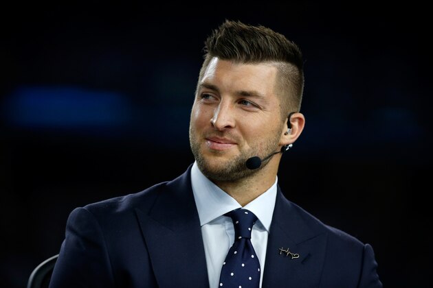 ARLINGTON, TX - DECEMBER 31:  Broadcaster Tim Tebow of the SEC Network speaks on air before the Goodyear Cotton Bowl at AT&T Stadium on December 31, 2015 in Arlington, Texas.  (Photo by Scott Halleran/Getty Images)