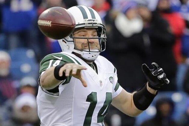 FILE - In this Jan. 3, 2016, file photo, New York Jets quarterback Ryan Fitzpatrick (14) throws a pass during the first half of an NFL football game against the Buffalo Bills in Orchard Park, N.Y. The New York Jets are heading to training camp with their expected starting quarterback still unsigned. Locked for months in a contract stalemate that remains uncertain to be resolved, Fitzpatrick is still waiting for a new deal. (AP Photo/Bill Wippert, File)