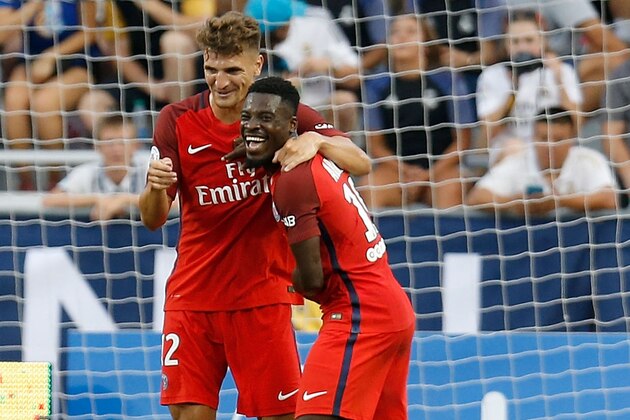 COLUMBUS, OH - JULY 27:  Thomas Meunier #12 of Paris Saint-Germain F.C is congratulated by Serge Aurier #19 of Paris Saint-Germain F.C after scoring a goal during the first half of the game against Real Madrid C.F. on July 27, 2016 at Ohio Stadium in Columbus, Ohio. (Photo by Kirk Irwin/Getty Images)