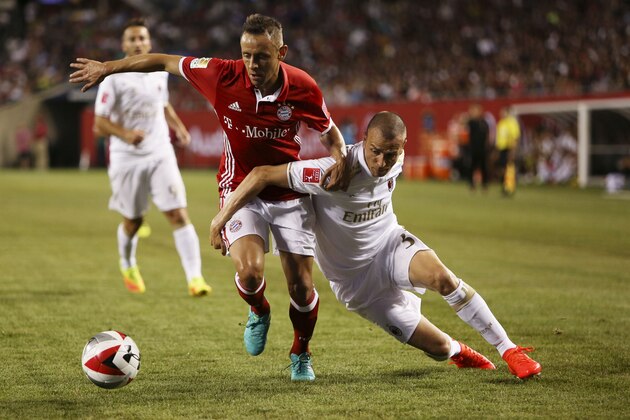 Rafinha #13 of FC Bayern Munich and Luca Antonelli #31of AC Milan fight for the ball at the International Champions Cup on July 27, 2016 at Solider Field Stadium in Chicago, Illinois.  / AFP / Tasos Katopodis        (Photo credit should read TASOS KATOPODIS/AFP/Getty Images)