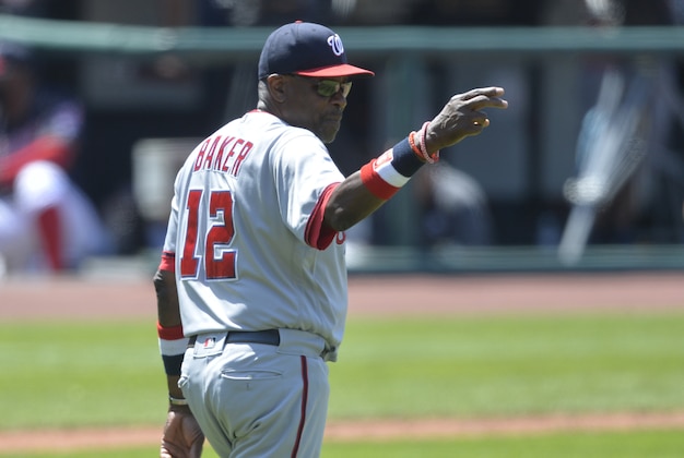 Jul 27, 2016; Cleveland, OH, USA; Washington Nationals manager Dusty Baker (12) makes a call to the bullpen in the eighth inning against the Cleveland Indians at Progressive Field. Mandatory Credit: David Richard-USA TODAY Sports