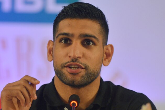 British boxer Amir Khan addresses a press conference in the Pakistani city of Karachi on June 1, 2016. 


British boxer Amir Khan hailed the decision to allow professional boxers at the upcoming Olympic Games in Rio de Janeiro, saying he would love to represent the country of his parents' birth, Pakistan. / AFP / RIZWAN TABASSUM        (Photo credit should read RIZWAN TABASSUM/AFP/Getty Images)