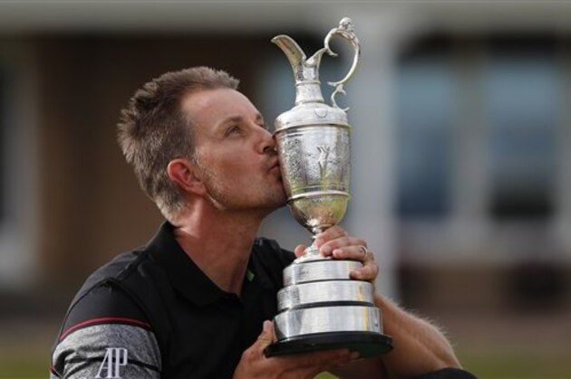 Henrik Stenson of Sweden kisses the trophy after winning the British Open Golf Championships at the Royal Troon Golf Club in Troon, Scotland, Sunday, July 17, 2016. (AP Photo/Ben Curtis)