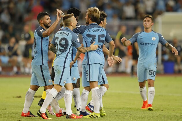 SHENZHEN, CHINA - JULY 28:  Sergio Aguero (L) of Manchester City celebrates with team mates after he scores the first goal during the 2016 International Champions Cup match between Manchester City and Borussia Dortmund at Shenzhen Universiade Stadium on July 28, 2016 in Shenzhen, China.  (Photo by Lintao Zhang/Getty Images)