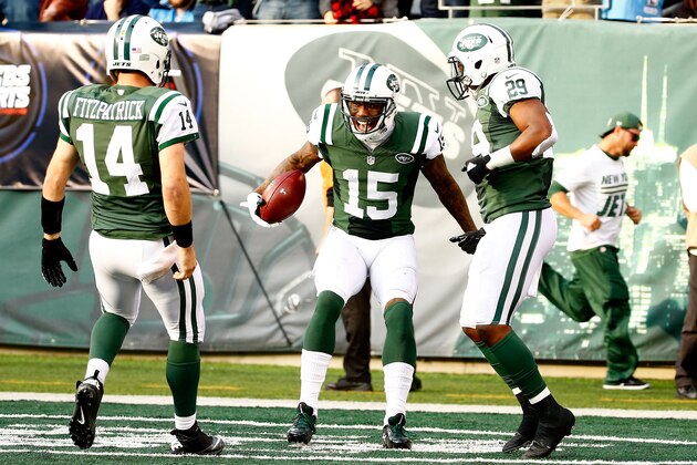 EAST RUTHERFORD, NJ - DECEMBER 13:  Brandon Marshall #15 of the New York Jets celebrates with  Ryan Fitzpatrick #14 after scoring a touchdown in the second quarter against the Tennessee Titans during their game at MetLife Stadium on December 13, 2015 in East Rutherford, New Jersey.  (Photo by Al Bello/Getty Images)