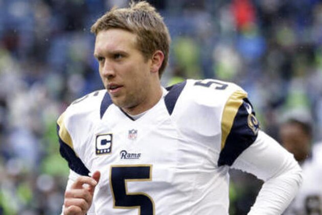 File-This photo taken Dec. 27, 2015, shows St. Louis Rams quarterback Nick Foles running on the field during warmups before an NFL football game against the Seattle Seahawks in Seattle. The Los Angeles Rams have released Foles after failing to find a trade destination for the disgruntled quarterback. The Rams announced the move Wednesday, July 27, 2016, one day before their veterans report to training camp. (AP Photo/Stephen Brashear, File)