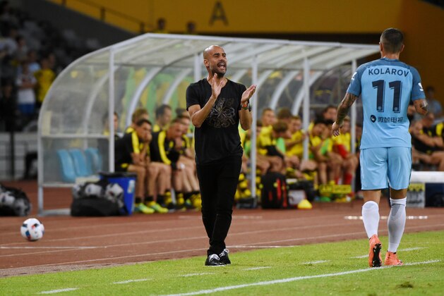 Manchester City's head coach Pep Guardiola applauds during the 2016 International Champions Cup football match between Manchester City and Borussia Dortmund in Shenzhen, south China's Guangdong province on July 28, 2016. / AFP / WANG ZHAO        (Photo credit should read WANG ZHAO/AFP/Getty Images)