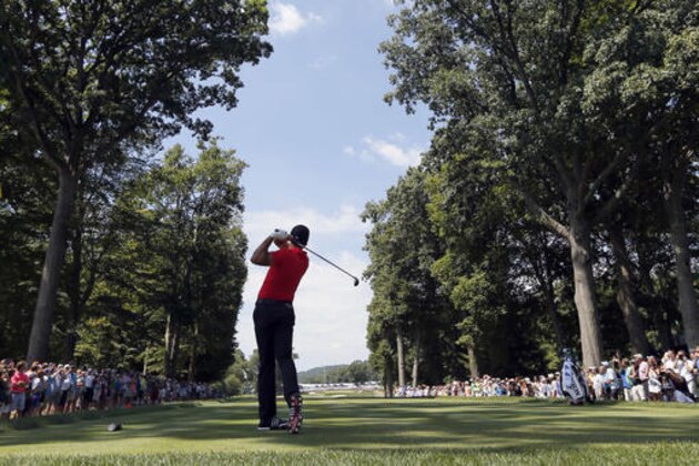 Jason Day watches his tee shot on the fifth hole during a practice round for the PGA Championship golf tournament at Baltusrol Golf Club in Springfield, N.J., Wednesday, July 27, 2016. (AP Photo/Tony Gutierrez)